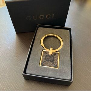 Gucci Black and Gold Logo Keyring